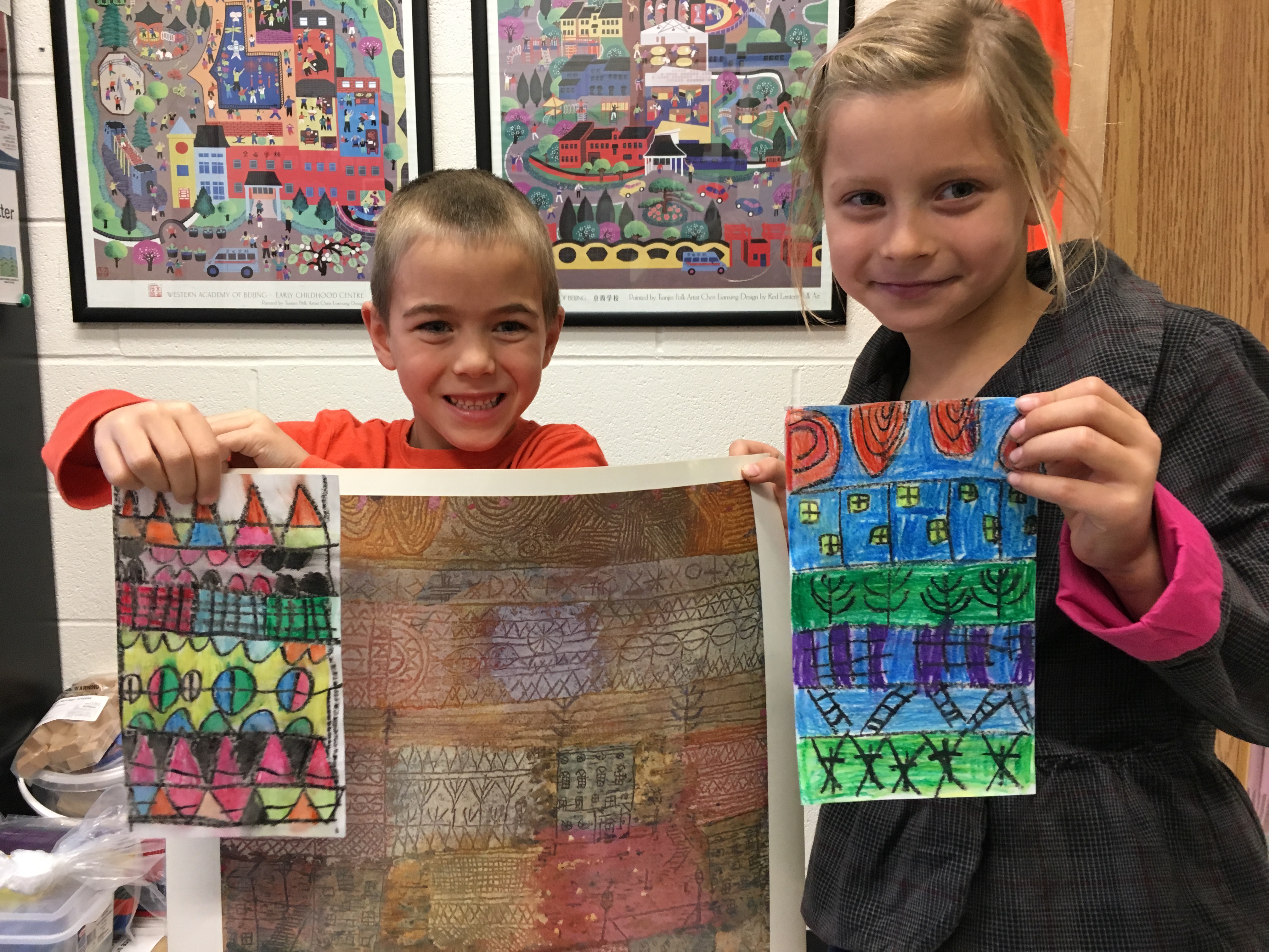 Students showing their artwork